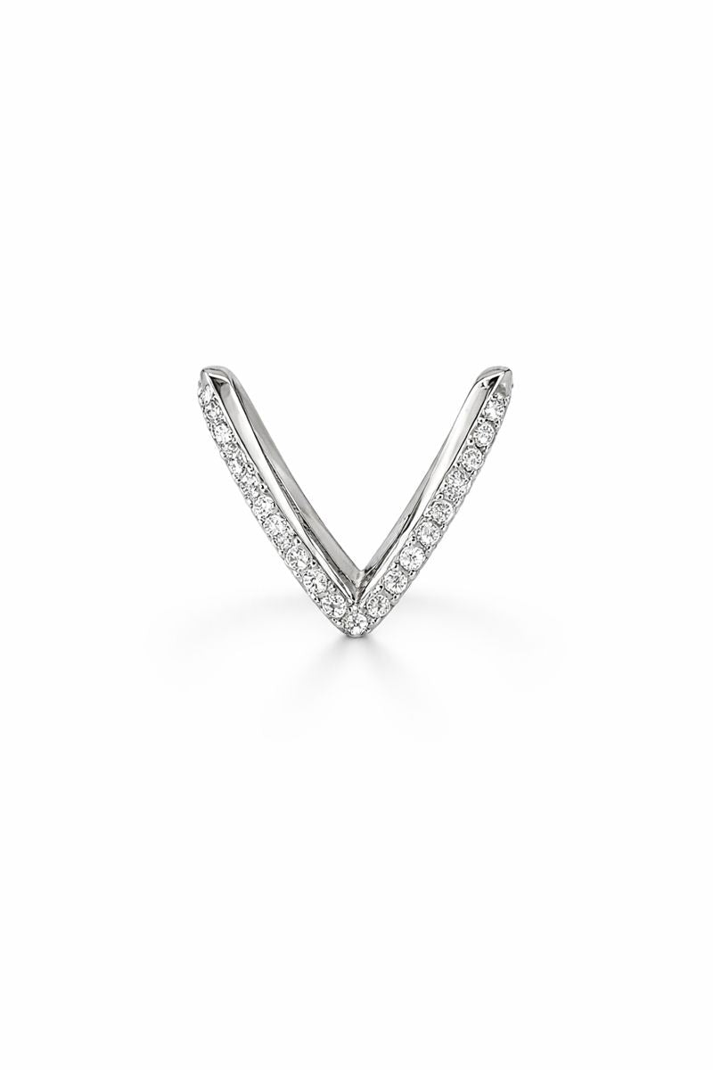 Silver V-shaped ring with small diamonds on a white background