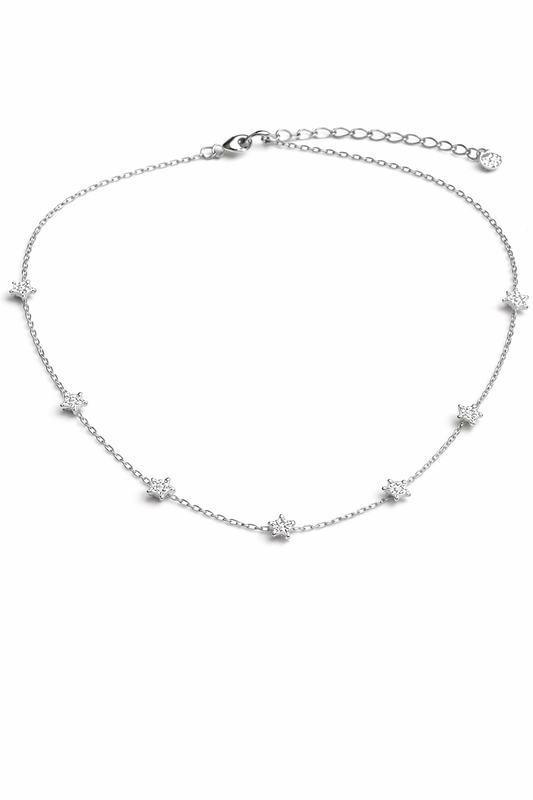 Silver necklace with star-shaped pendants on a white background
