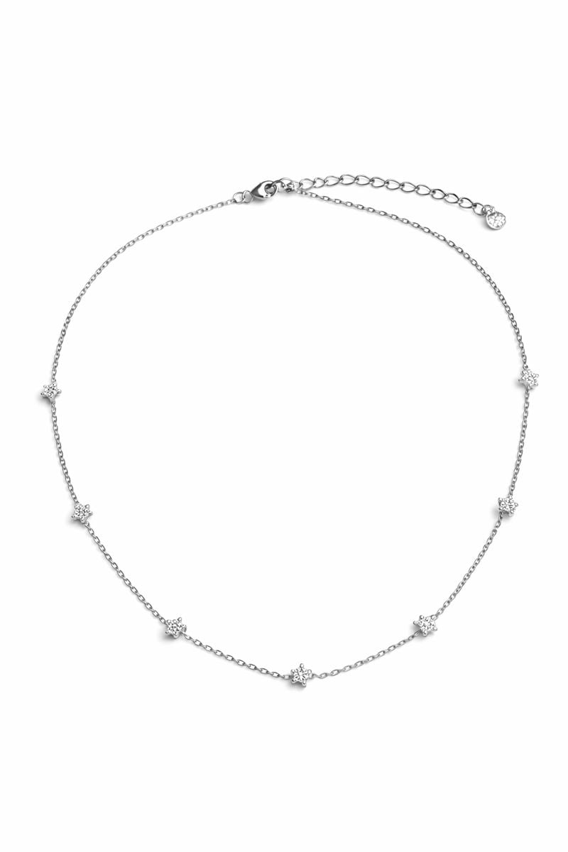Silver necklace with small diamonds on a white background